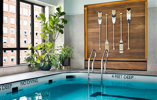 South Park Tower indoor pool with plants and decor